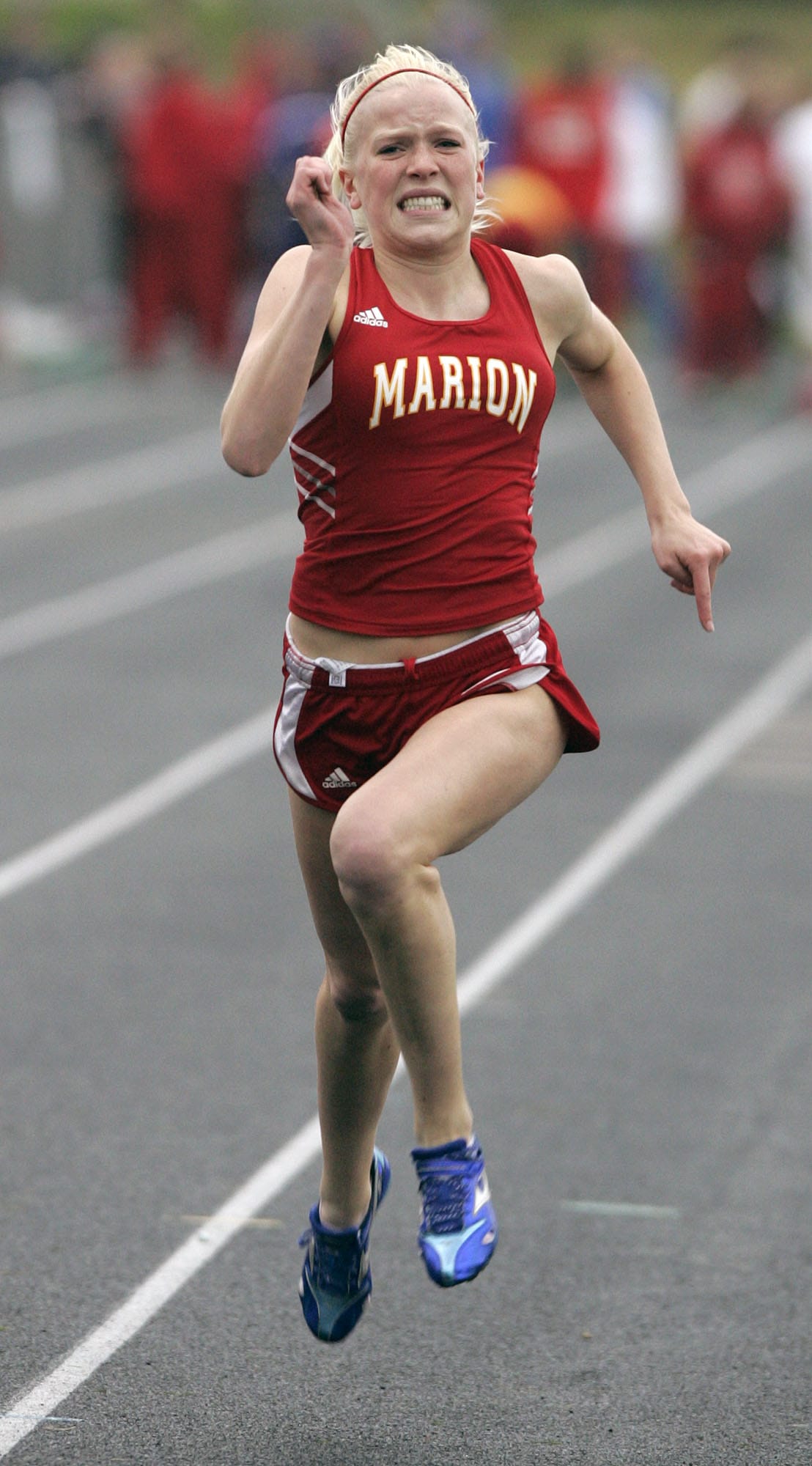 Marion High School sprinter at the finish line