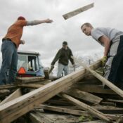 Josh Langhoff (16), Ryan Young (16), and Sam MacDonald (13), all students at Alburnett High School, help clean up a tornado's aftermath in Alburnett on Tuesday, April 28, 2009. A tornado struck the area on Sunday, causing no injuries, but downing large trees and destroying at least three large campers. Two Alburnett High School teachers, Linda Franck and Vicki Meadows, organized the student clean because many students were affected by the storm. (Chris Mackler/The Gazette).