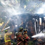 Firefighters from Osolo, Cleveland and Bristol extinguish a fire at an abandoned home located on Medford Street in Elkhart (Osolo Township) on the evening of Wednesday, June 30, 2010. The cause of the fire is currently unknown; no people were injured as a result of the fire.