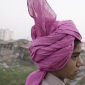 A wedding guest watches a wedding parade in the town of Navsari in Gujarat, India. Traditionally, Indian weddings are elaborate celebrations filled with rituals and customs dating back thousands of years. Weddings are usually between arranged couples, or those who have been partnered together by the bride and groom?s families for financial gain and family partnership. The marriage of Suketu Soni and Divya Agarwal, however, was a more modern love marriage.