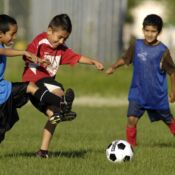 Angel Luna, David Castameda and Agil Erasma (from left) battle for the ball during practice of the U-9 youth soccer division at NIBCO Fields in Elkhart on Wednesday. Local soccer fans such as these youngsters are keeping close tabs on the World Cup.